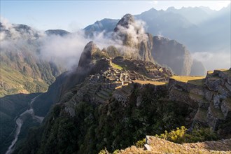 Machu Picchu in morning light with tourists
