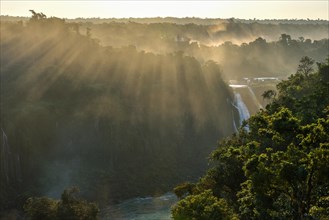 View from the waterfall Salto Santa Maria over the rainforest of Isla San Martin at sunset