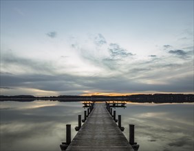 Jetty at sunrise on Worthsee Lake in Inning