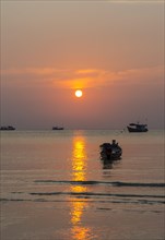 South China Sea at sunset with boats