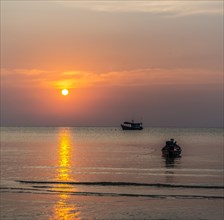 South China Sea at sunset with boats