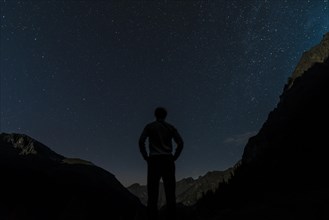 Silhouette of person gazing at the stars