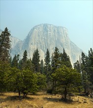 El Capitan in smoke from a forest fire
