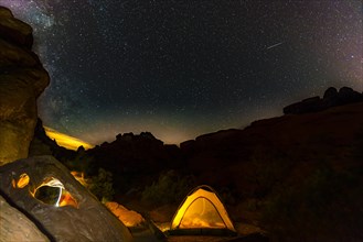 Tent on a campsite with starry sky above