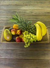 Wooden bowl full of fruit