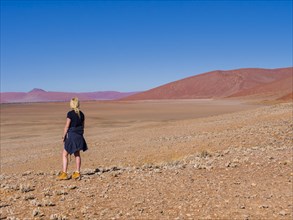 Woman standing in the Namib Desert