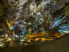 Stalactites in the colorfully lit cave Cuevas de Nerja