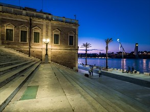 Wide staircase at the harbour at dusk