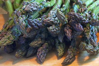 Fresh green asparagus on a wooden board