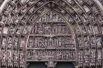 Rich sculptural decoration in the tympanum of the portal at the Strasbourg Cathedral