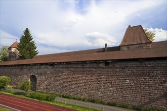 Restored old city walls with a covered walkway