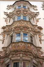 Multistory oriel with baroque stucco