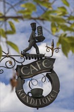 Wrought iron signboard of a pastry shop