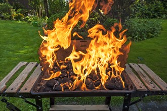 Flames on a charcoal grill