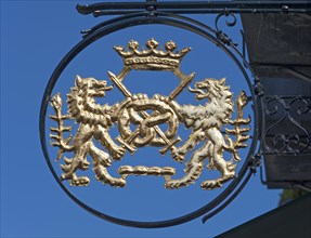 Bakery signboard with lions and pretzel
