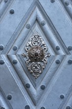 Old doorknob at entry portal