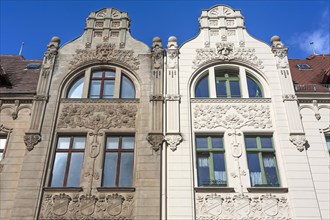 Restored and unrestored Art Nouveau facade