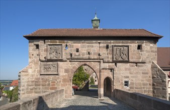 Castle gate with two coats of arms