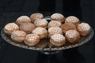 Berliner or doughnuts on a silver platter