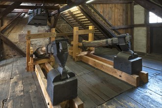 Old blacksmith's hammers and above an old bellow of 1875