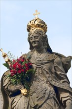 Statue of Empress Kunigunde with a bunch of roses