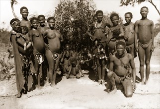 Bushman families in front of a hut