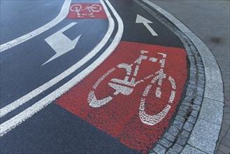 Red marked bicycle paths on the roadway