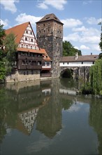 Old timbered houses and hanging tower and bridge
