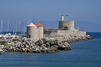 Windmills and Agios Nikolaos fortress at Mandrake harbor