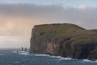 Sea stacks Risin og Kellingin in the evening light