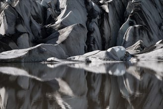 Glacier tongue reflected in the water