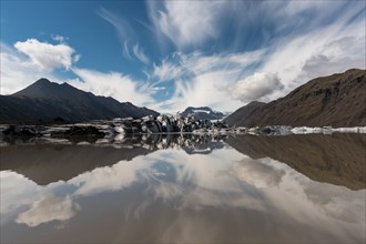 Glacial lake with icebergs and ice floes