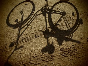 Shadow of a woman's bicycle