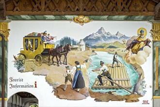 Luftlmalerei mural with stagecoach and raft on Isar river at the town hall of Wallgau