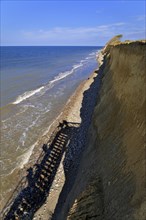 Shadow cast by steel staircase at cliffs of Ahrenshoop
