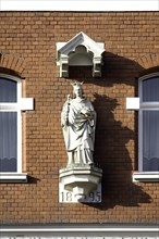 Figure of a saint on a house