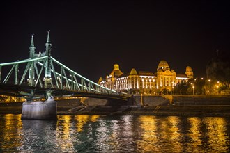 Illuminated bridge and the Gellert Hotel at night