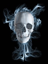 Human skull surrounded by smoke