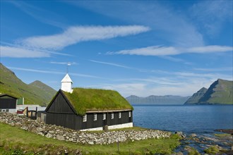 Old Faroese wooden church with a grass roof
