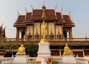 Golden Buddha statues in front of Wat Baan Rai
