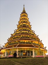 Illuminated nine-story pagoda of the Wat Huay Pla Kang temple