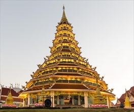 Illuminated nine-story pagoda of the Wat Huay Pla Kang temple