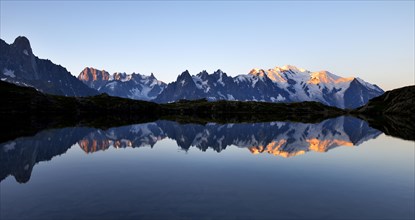 Mont Blanc massif at sunrise reflected in Lac de Chesserys