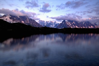 Mont Blanc massif in the evening light reflected in Lac de Chesserys