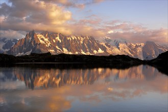 Mont Blanc massif in the evening light reflected in Lac de Chesserys