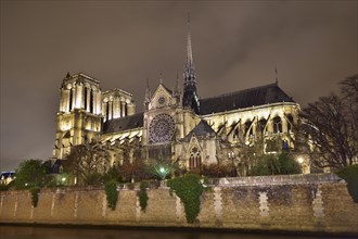 Gothic cathedral Notre Dame de Paris with the Seine river