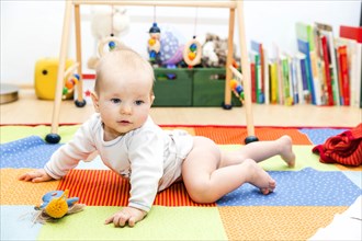 Baby first crawling attempts