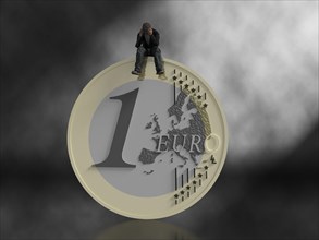 Man sitting on euro coin