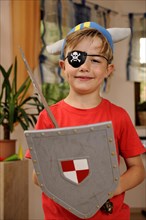 Boy dressed as viking with pirate's eye patch