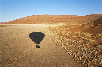 Shadow of a hot-air balloon in the Namib Desert